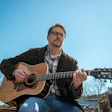 stephen flatt playing acoustic guitar