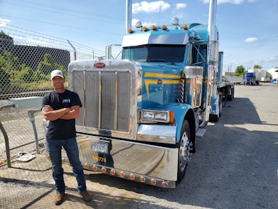 Wesley Ward having posing for photo outside of his custom Peterbilt