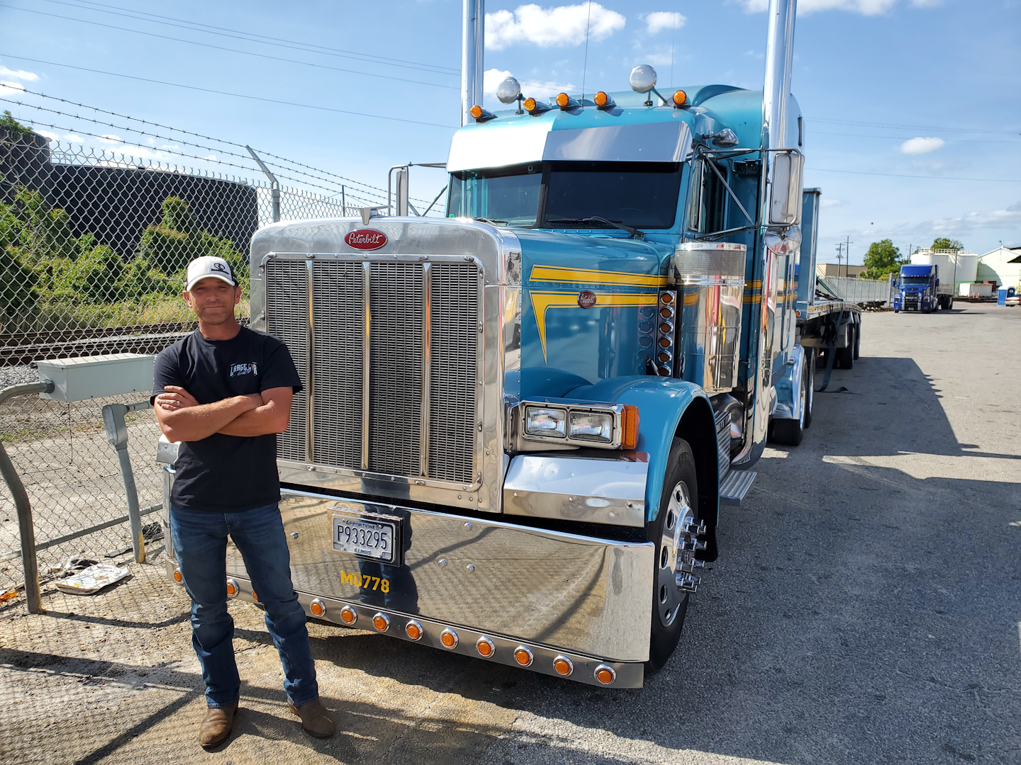 Wesley Ward having posing for photo outside of his custom Peterbilt