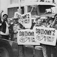 truck drivers in front of a semi-truck holding signs with the text shutdown #2 january 31 until as long as it takes on them