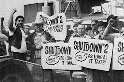 truck drivers in front of a semi-truck holding signs with the text shutdown #2 january 31 until as long as it takes on them