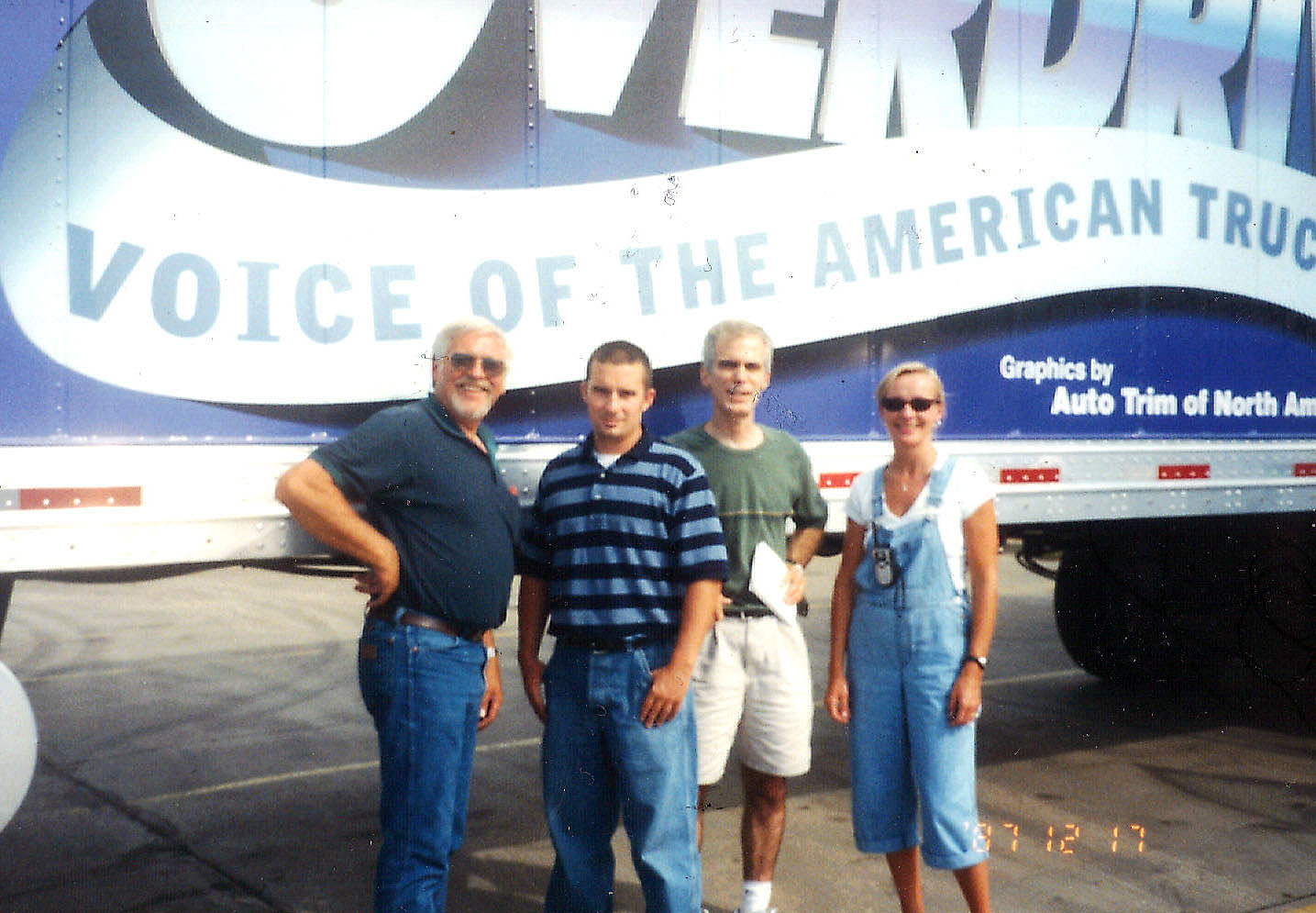 In my early years at Overdrive the magazine celebrated its 40th anniversary with a 2001 tour around the country, stopping at truck stops and hosting truckers to see a trucking history exhibit staged in the dry van. Editors and sales personnel joined driver Harvey Zander, left, well-known for his show trucks Icy Blu and Icy Blu II, in different segments as the tour progressed. Zander drove a new Volvo VN770, swapping out occasionally with me and other editors who had recently obtained their CDL. Joining Zander in one leg were, from left: Scott Miller, then a sales rep and now executive vice president for Overdrive publisher Randall-Reilly&rsquo;s Recruiting Division; me, then Overdrive senior editor and now editorial director; and Linda Longton, then Overdrive editor and now senior vice president of audience for Randall-Reilly.