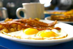 sunny-side up eggs and bacon on a plate