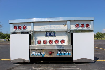 back of semi truck with hang loose sticker