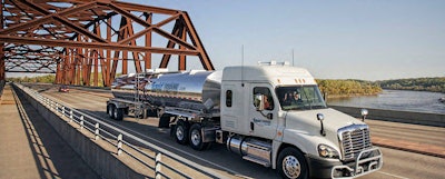 semi truck driving across bridge