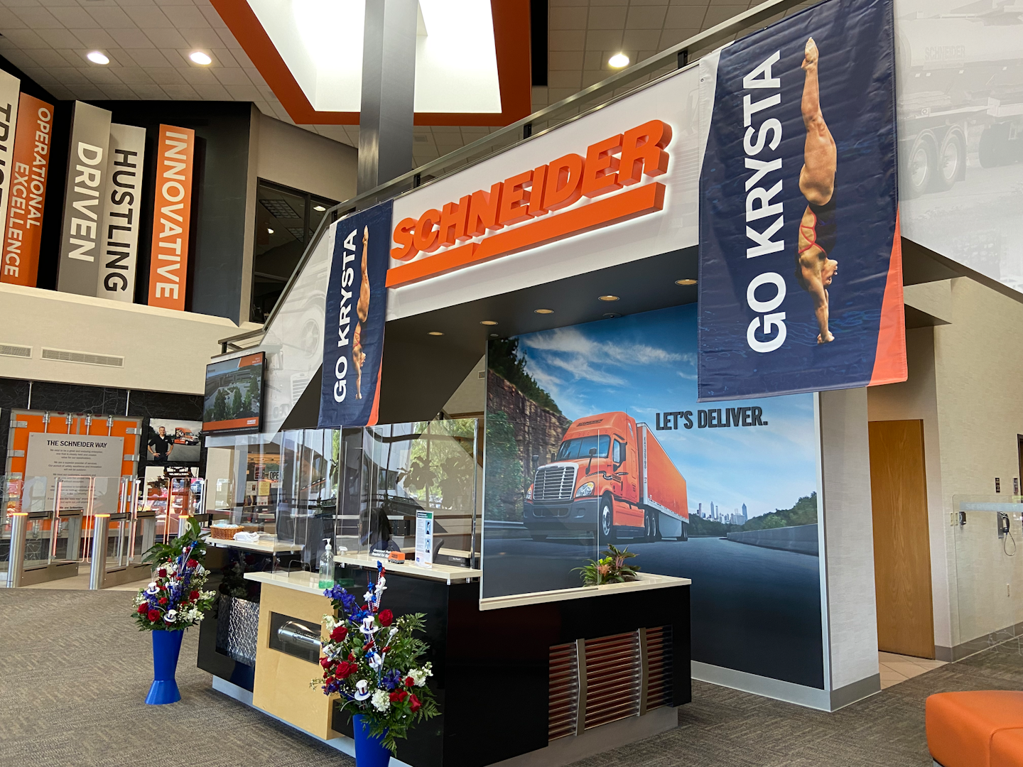 Fleet cheers on Olympic diver, daughter of one of its drivers | Krysta Palmer is competing for the U.S. team of divers in the Tokyo Olympics. Palmer is the daughter of Schneider driver Mitch Palmer and his wife, Vicki. She narrowly missed making the 2016 U.S. team, and continued training in hopes of making it to 2020, now 2021 after the pandemic pushed the games back a year. Last month Schneider routed the Palmers to Indianapolis so they could be in the stands as their daughter qualified for the team, though the proud parents won't be able to travel to Tokyo with pandemic restrictions in place. Schneider, as the picture of the company headquarters' lobby above shows, is helping rally around the diver from afar. Large banners and posters are similarly on display at company facilities across the country. Palmer and her partner, Alison Gibson, placed 8th in the Final 3m Synchronized Springboard Sunday. Competition for the next event, 3m Individual Springboard, begins Friday. Catch her live: Friday, July 30, 1 a.m. Central -- Prelim. 3m Individual Springboard; Saturday, July 31, same time -- Semifinal 3m Individual Springboard; and Sunday, August 1, same time -- Final 3m Individual Springboard.