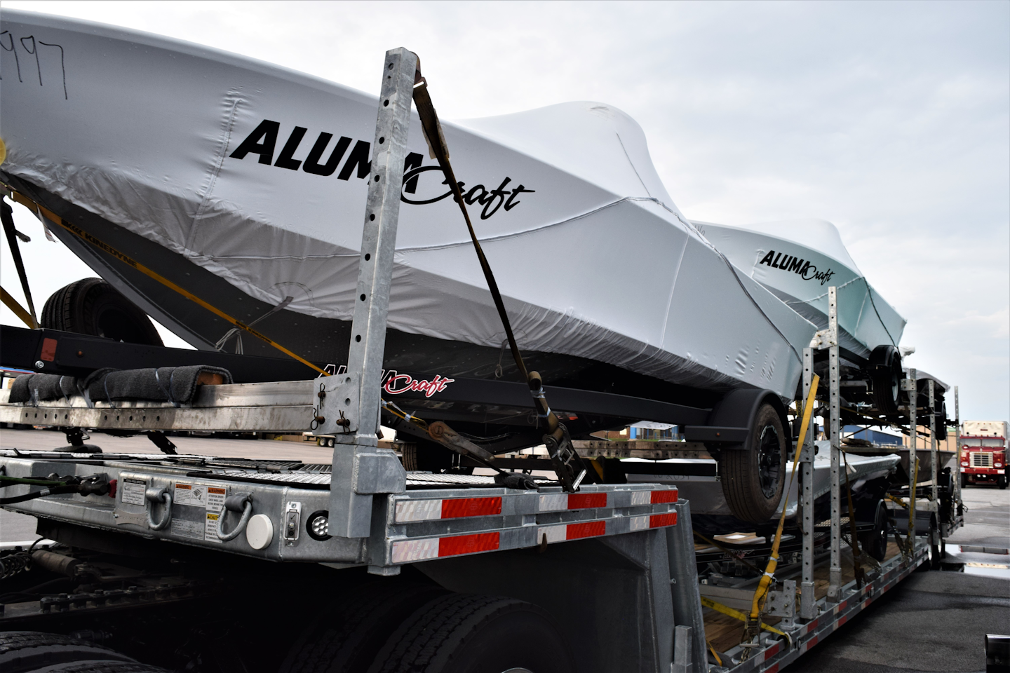 The open-deck trailer is one of many built to the company's specs by Shipshe Trailers out of Shipshewana, Indiana, and the load's a bit of a securement puzzle, no doubt. In large part, though, Stratton picks 'these trailers up pre-loaded' and strap-happy at Alumacraft sites, going to places across the U.S. and Canada.