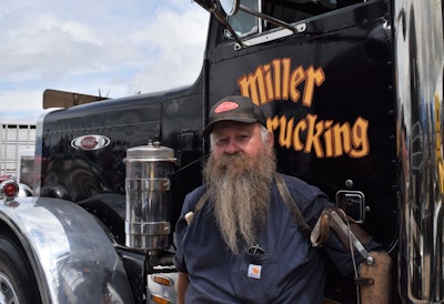 W. Tim Miller standing beside his 1982 Peterbilt 359