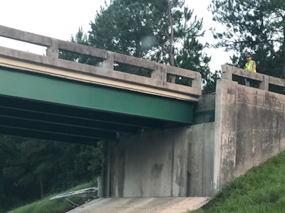 A raised dump bed struck the Georgia Highway 86 bridge over I-16, causing the highway to be shut down. Crews demolished the bridge and reopened the interstate ahead of schedule.