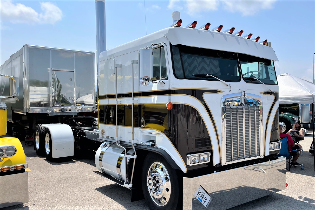 Lifetime Nut Covers owner J.R. Schleuger, also with a trucking operation out of Britt, Iowa, is showing this pristine 1985 Kenworth K100, Cole notes the podcast, lauding the detail work.