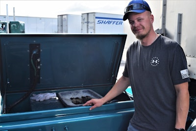 Chris Young standing by his in-frame deck-mounted storage box