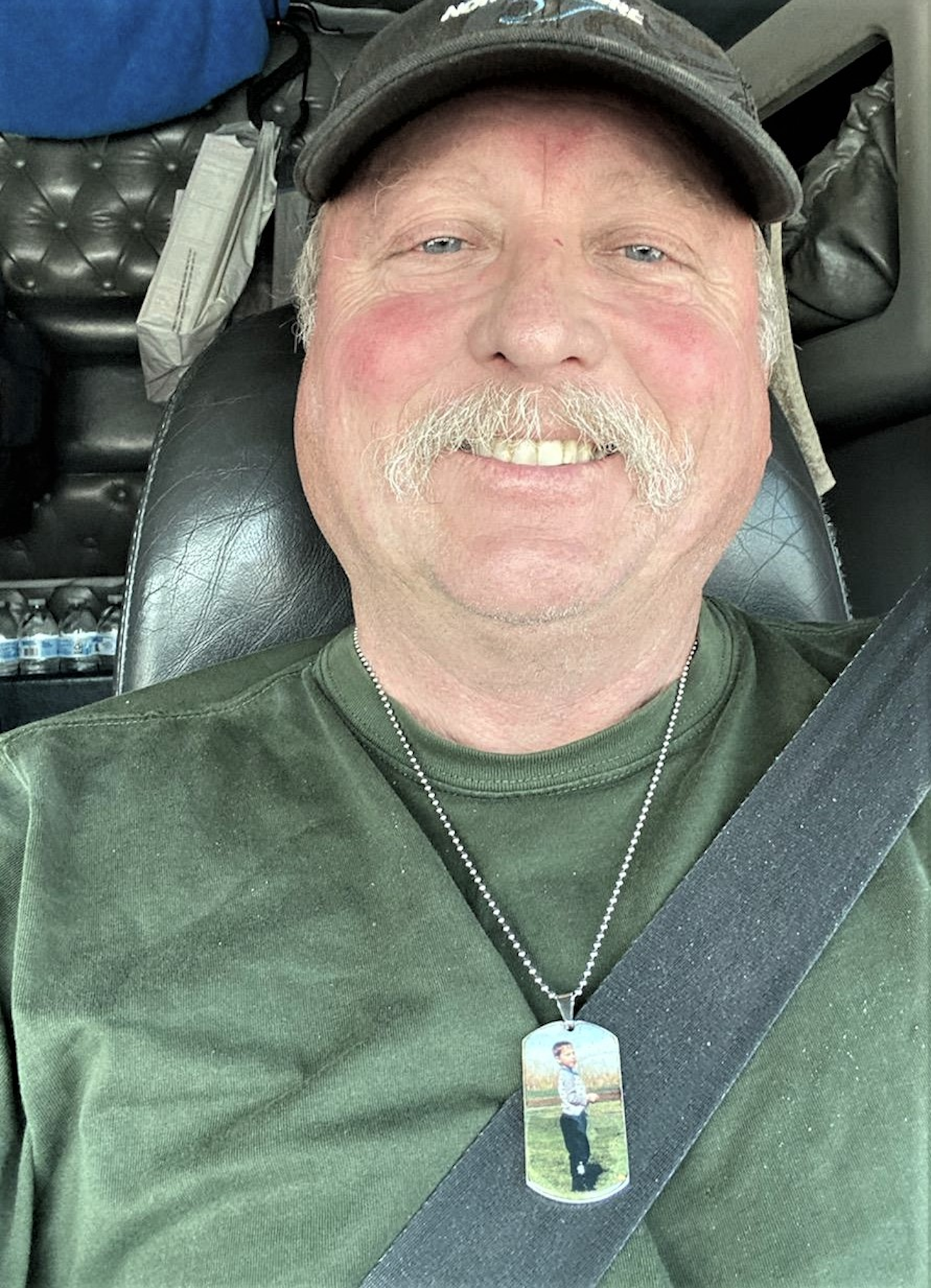 Owner-operator Howard Salmon, here pictured, reports a lot of business as usual this week at the scale houses, as far as he can tell. He's been only in and out of Illinois and Wisconsin this Brake Safety Week so far, though. On Howard's necklace you'll see his son, Liam, who tragically passed on New Year's Eve last year.