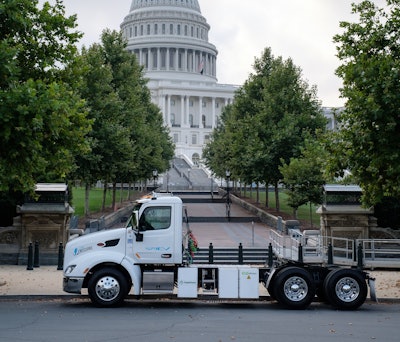 The next day, the battery-electric Model 579EV was on display at Peace Monument directly in front of the steps leading up to the Capitol building, as shown.