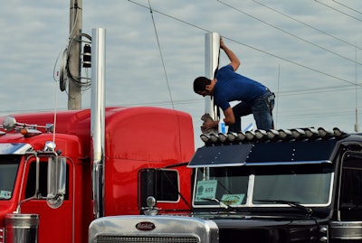 man polishing stacks on truck