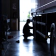 Technician working on truck tire