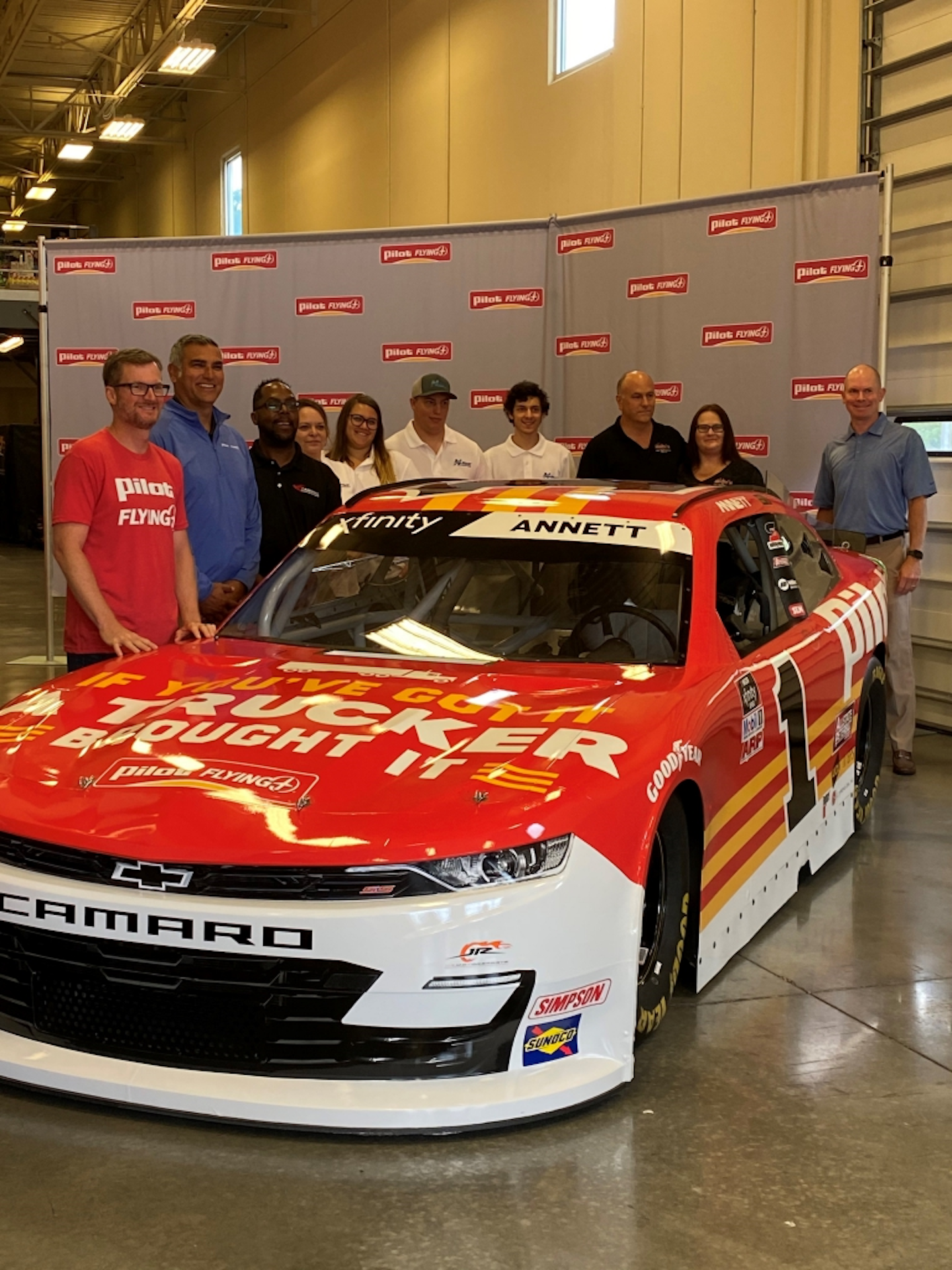 Pilot, Dale Jr. honoring truckers for Truck Driver Appreciation Week | Former NASCAR driver and current car owner Dale Earnhardt Jr., driver Michael Annett and Pilot Flying J VP Steve Vanderink this week unveiled the paint scheme of the No. 1 Pilot Flying J Chevrolet to celebrate the contributions of the 3.6 million professional truck drivers who keep the economy moving. National Truck Driver Appreciation Week will be held Sept. 12-18. Leading up to the week honoring truckers, the car, driven by Annett, will compete in races on Aug. 27 at Daytona International Speedway, Sept. 4 at Darlington Raceway, Sept. 11 at Richmond Raceway, and Sept. 17 at Bristol Motor Speedway.