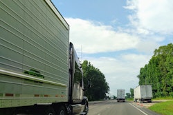 Trucks on highway with one broken down