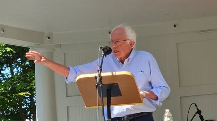 Bernie Sanders speaking at a podium