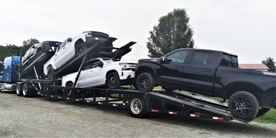 David Bunting's five-car Sun Country trailer loaded with pickup trucks