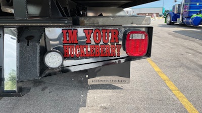 'I'm your Huckleberry' on rear bumper of 1996 International 4900 tow truck