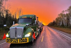 ptsi truck hauling an oversized load at sunrise