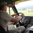 A soldier in the National Guard drives a truck