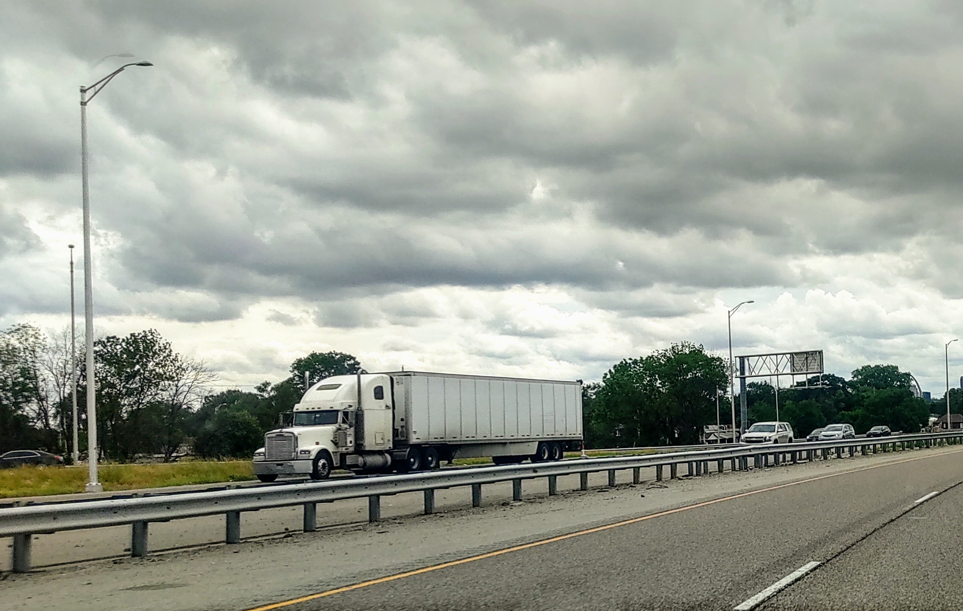 Trucck On Highway Guardrail