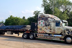 MSR Transport Services' Ride of Pride 2022 Western 5700XE, hooked to a loaded flatbed