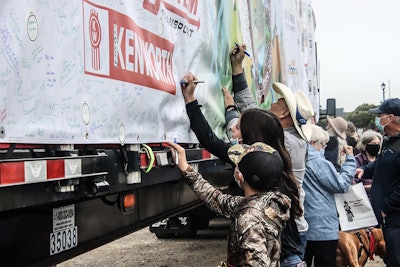 People sign trailer of U.S. Capitol Christmas Tree