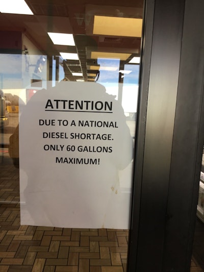 Image shows a sign in the window of Kingman, Arizona, Petro shop warning of a diesel fuel shortage.