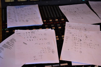 music charts on a mixing board