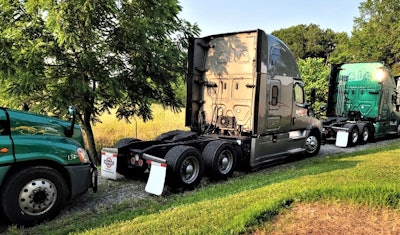 DeWitt Transportation trucks parked in a row