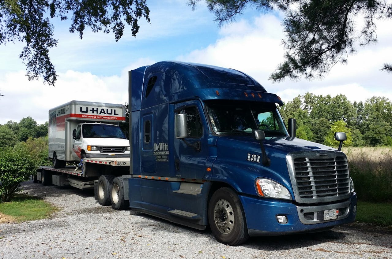 DeWitt's history as a business owner runs in part through this 2017 Freightliner Cascadia (pictured when he was pulling a step deck). 'Chrome does not make you any more money,' he said. 'It’s just something you have to polish. I've never been one to do anything special.' Today, on his personal truck, the extent of his custom modifications are 'a little airborne sticker on either side of the doors.' DeWitt served in the military in the Army.