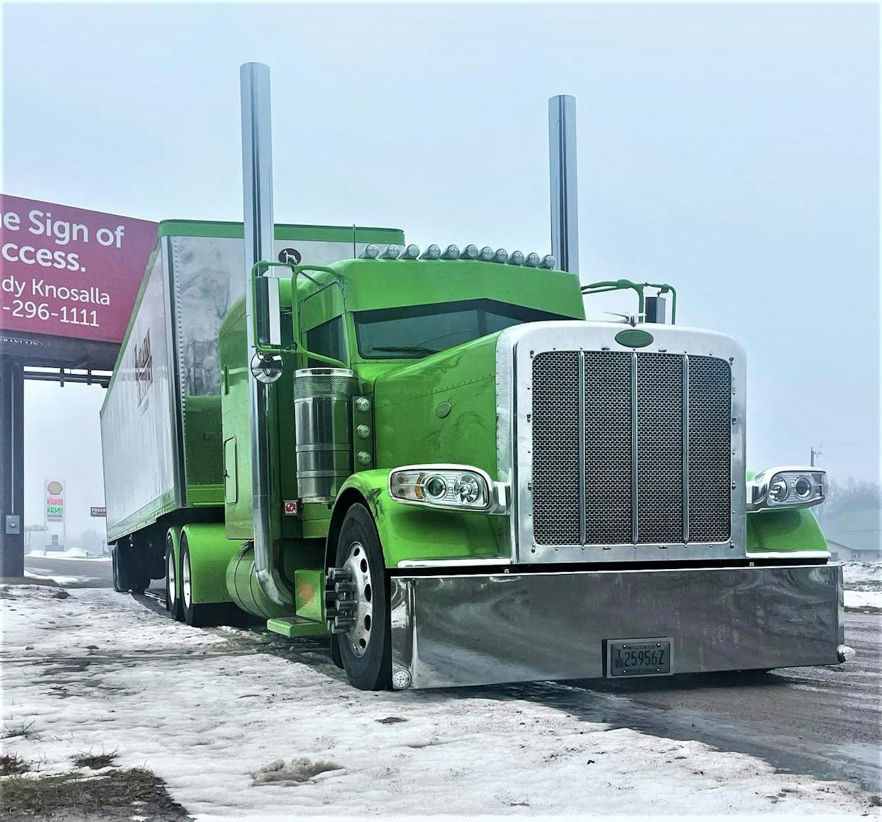 Hallahan's 2021 Peterbilt 389 parked on side of road in the snow