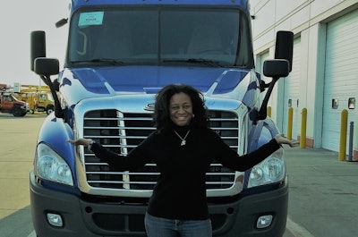 Kenyette Godhigh-Bell standing in front of her 2017 Freightliner Cascadia