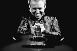 Mike Murchison holding a guitar