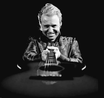 Mike Murchison holding a guitar