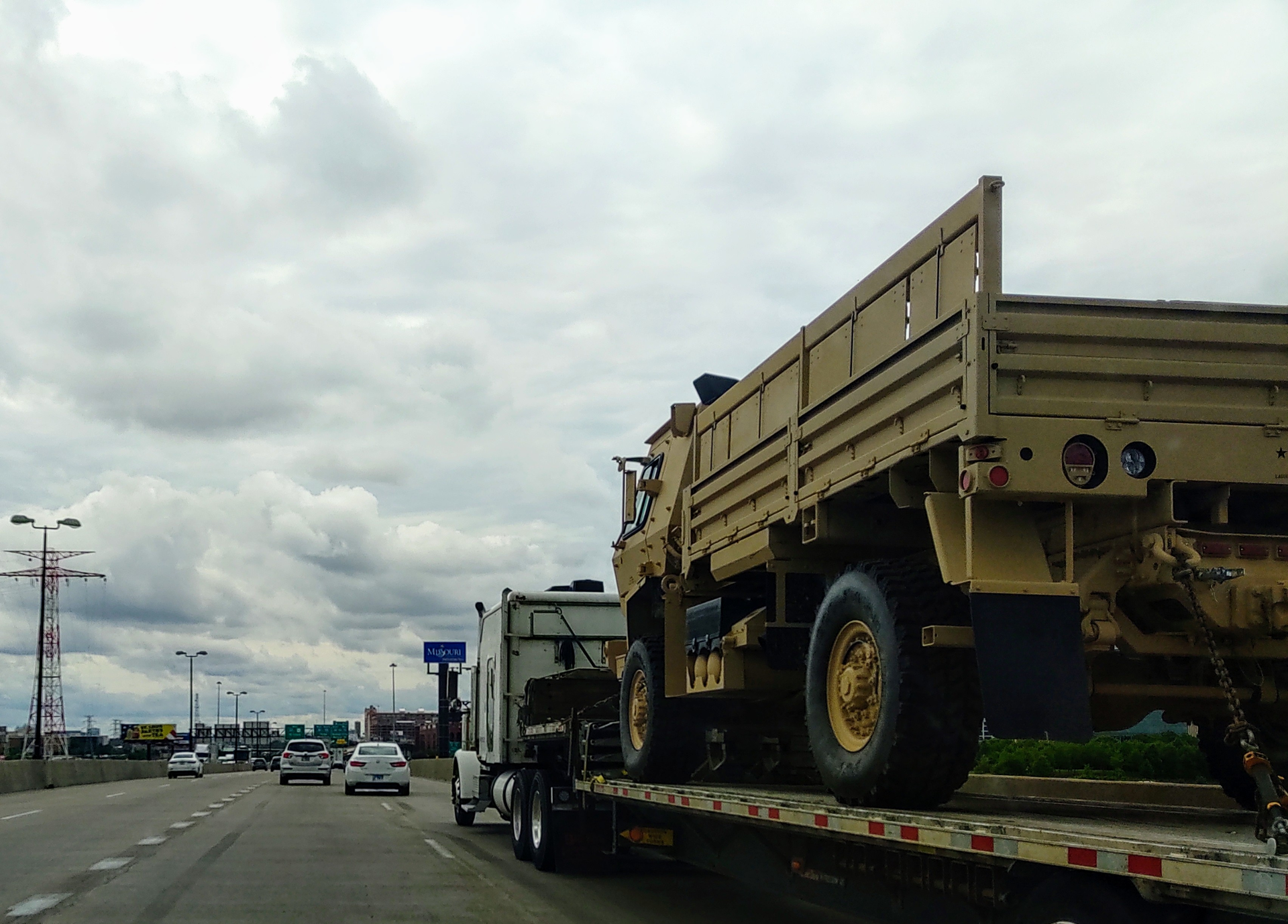 Military Vehicle On Flatbed Truck Highway 2