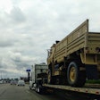 Military Vehicle On Flatbed Truck Highway 2