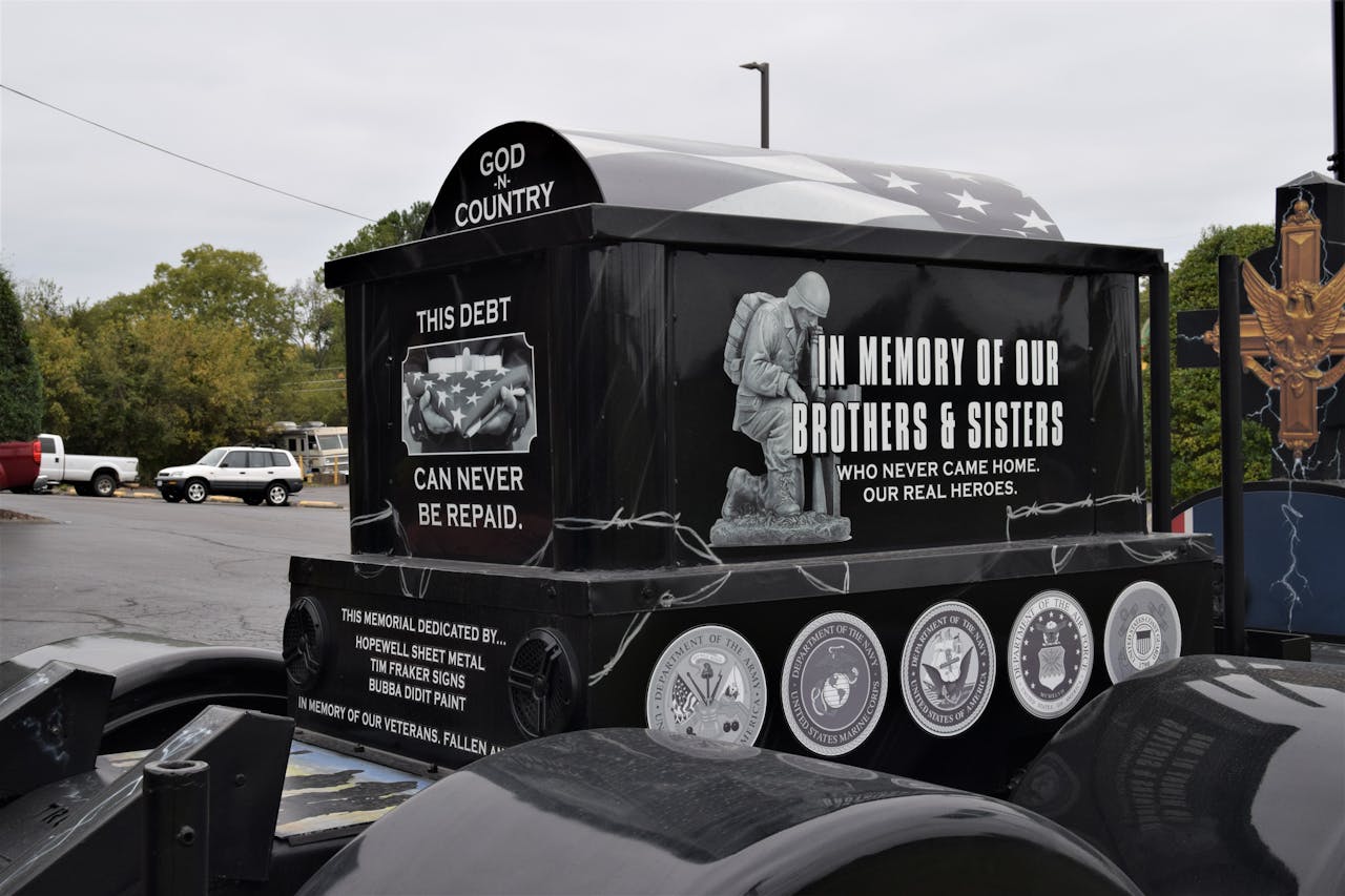 A memorial to fallen soldiers mounted on the catwalk of Chuck Timbrook's Black Out Freightliner Classic