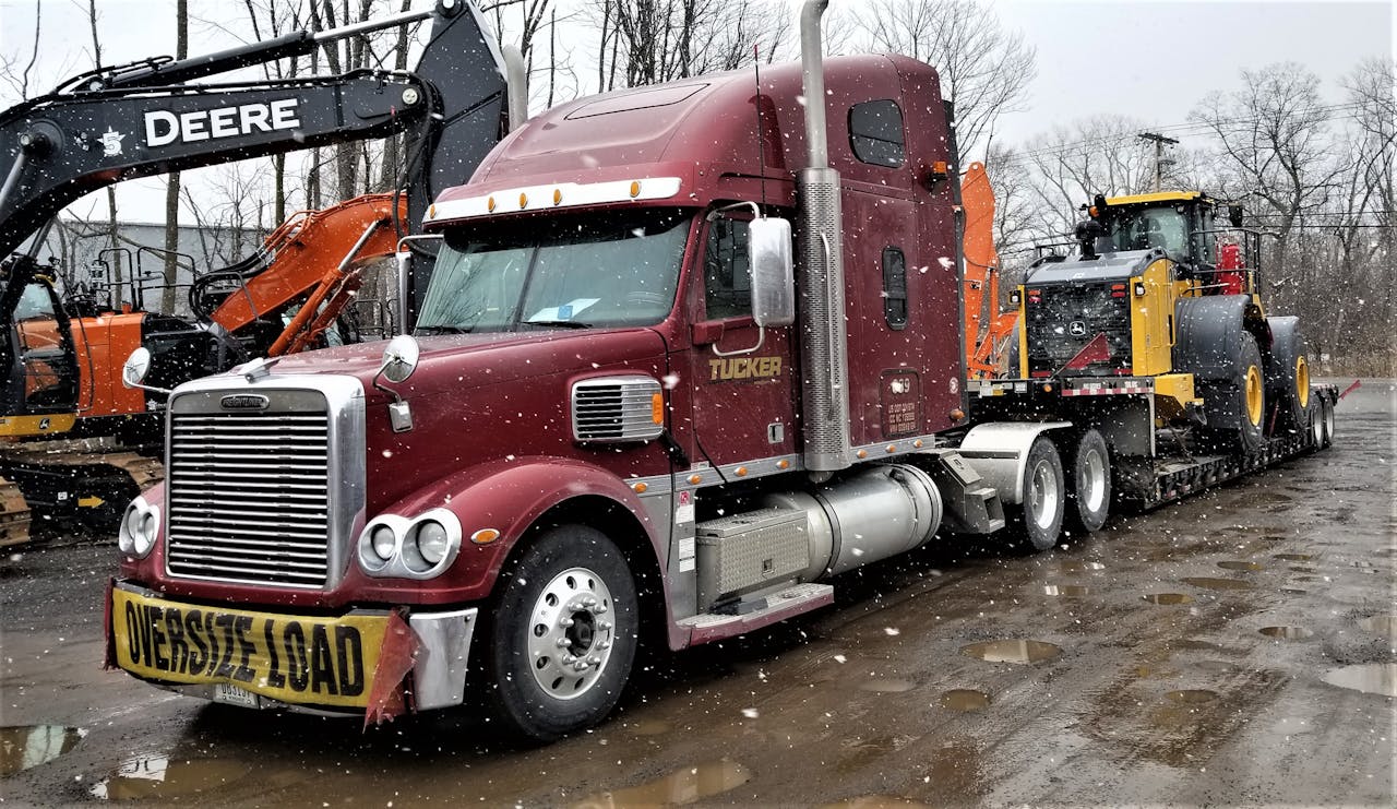 Among the variety of trailers Smith pulls for Tucker Freight Lines are RGNs like these.