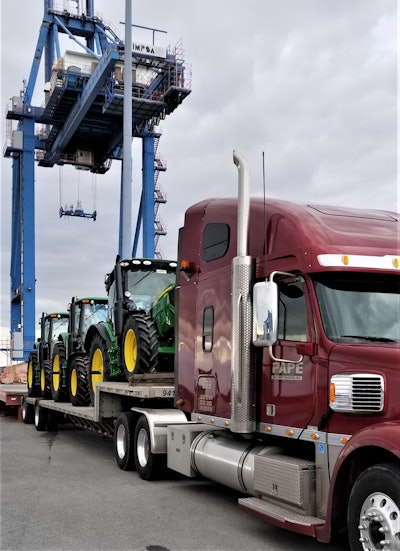 John deere equipment on truck trailer