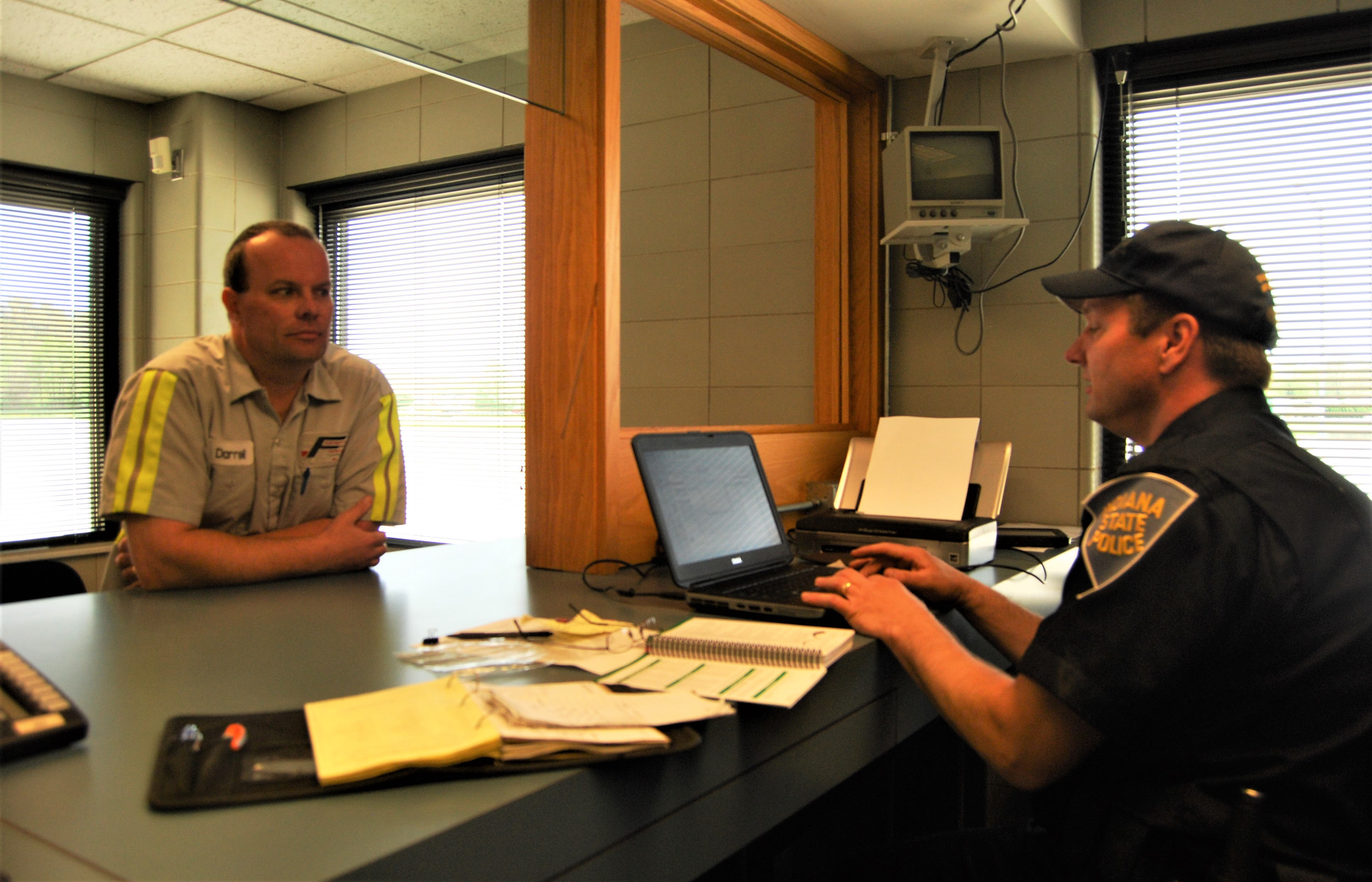 driver at counter with officer