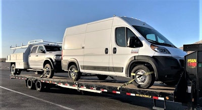 flatbed with vehicles on it