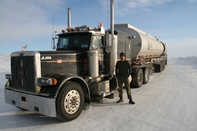 Gord Magill next to truck on ice