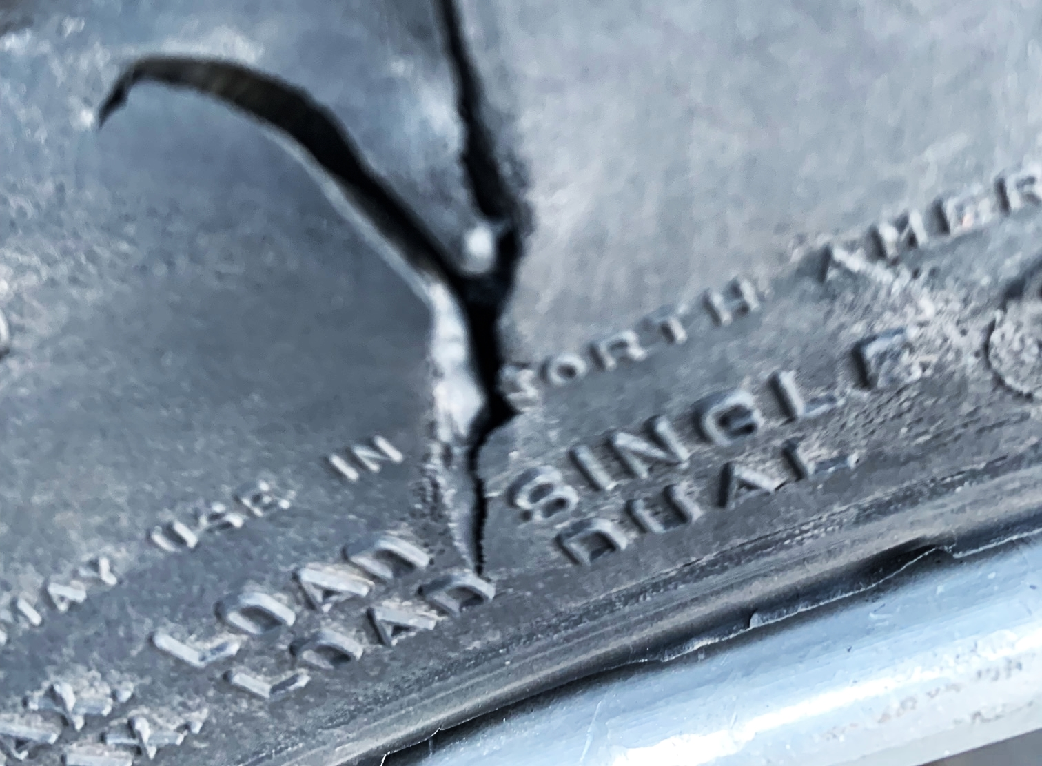 Tire with sidewall cut