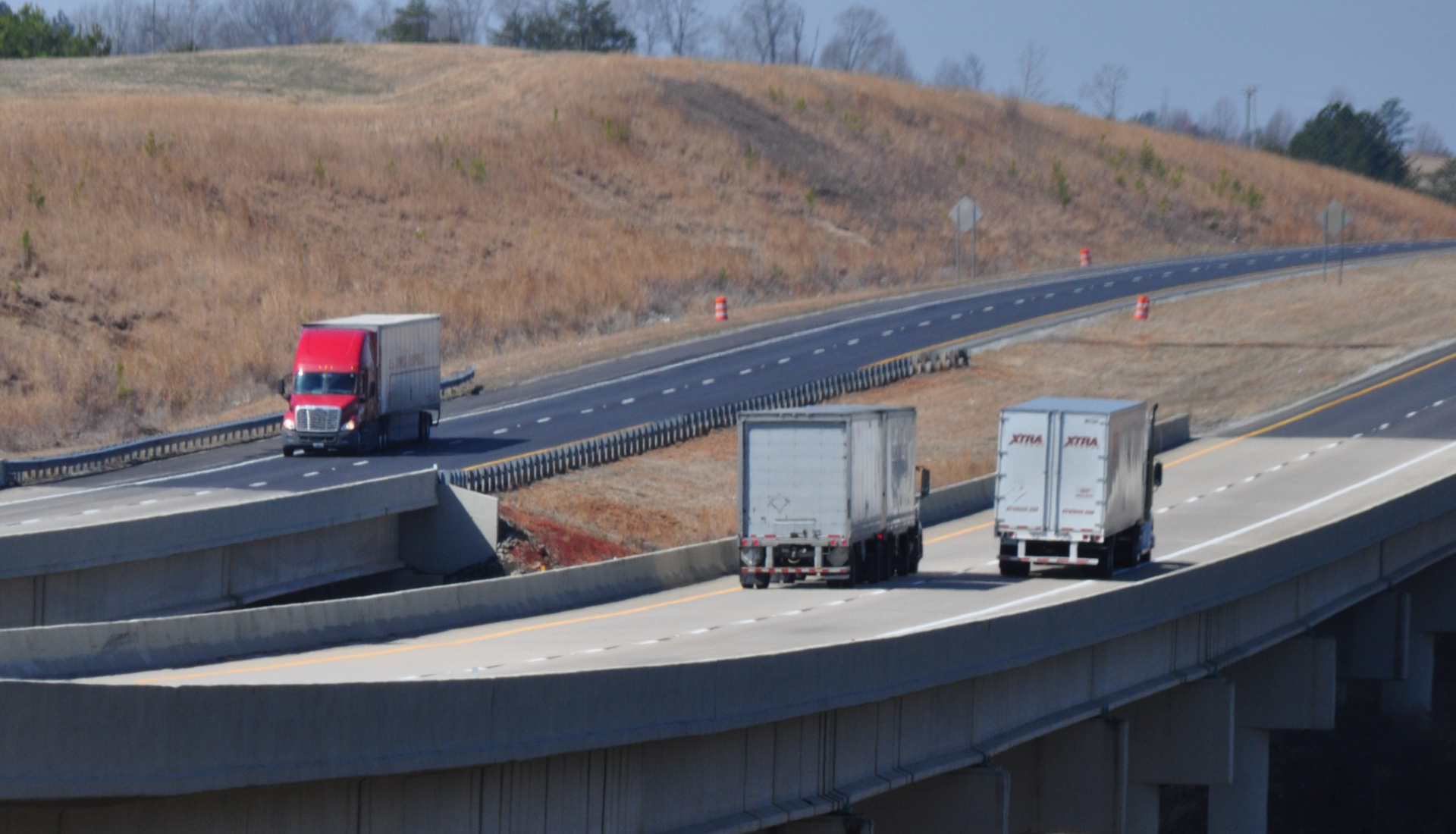 Pair Of Trucks On Highway Bridge