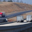 Pair Of Trucks On Highway Bridge