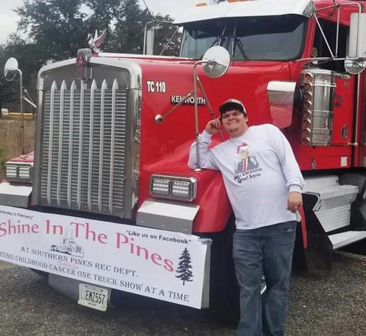 Dakota McDaniel standing beside his Kenworth truck