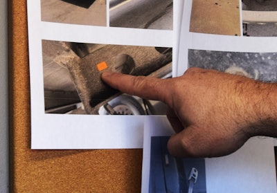 Cowan pointing to a sticker found during a pretrip inspection